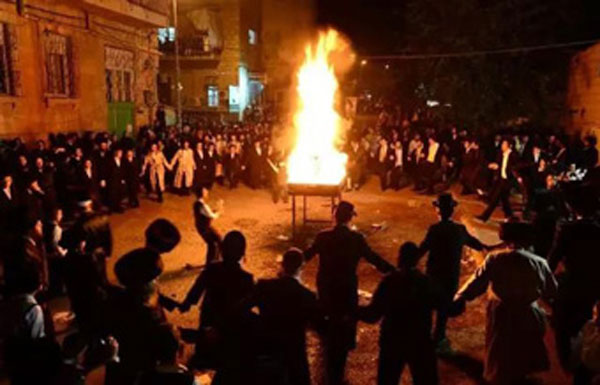 Celebration of Lag BaOmer with bonfire at night.