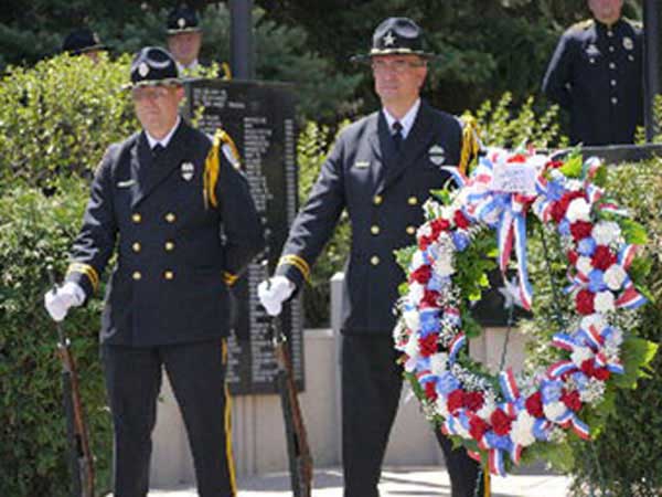 Peace Officers Honor Guard stand watch over memorial service.
