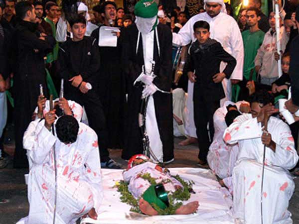 Reenactment of death of Imam Hussain’s martyred son in Manama, Bahrain.