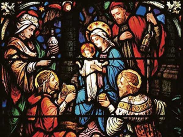 Stain glass of the three wise men visiting Jesus.